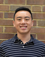 Eric Zhu poses for a photo at the Chaifetz School of Business