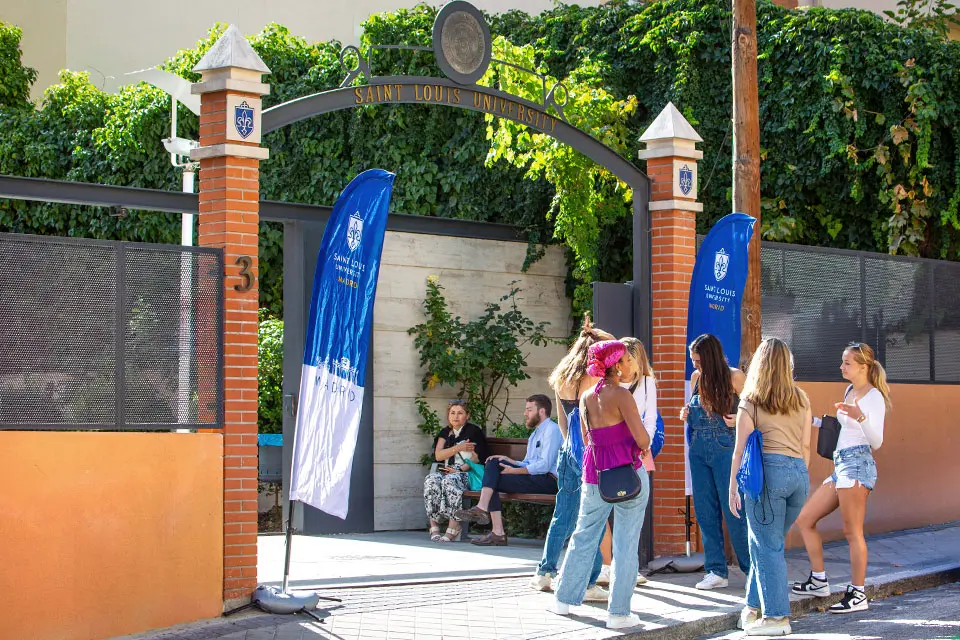 Students talking at San Ignacio Hall entrance.