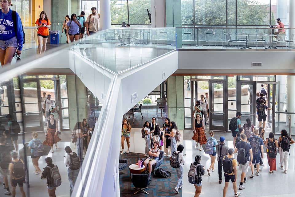 A birds-eye view of the entrance of the ISE building. Students walk in and out of the building on their way to class